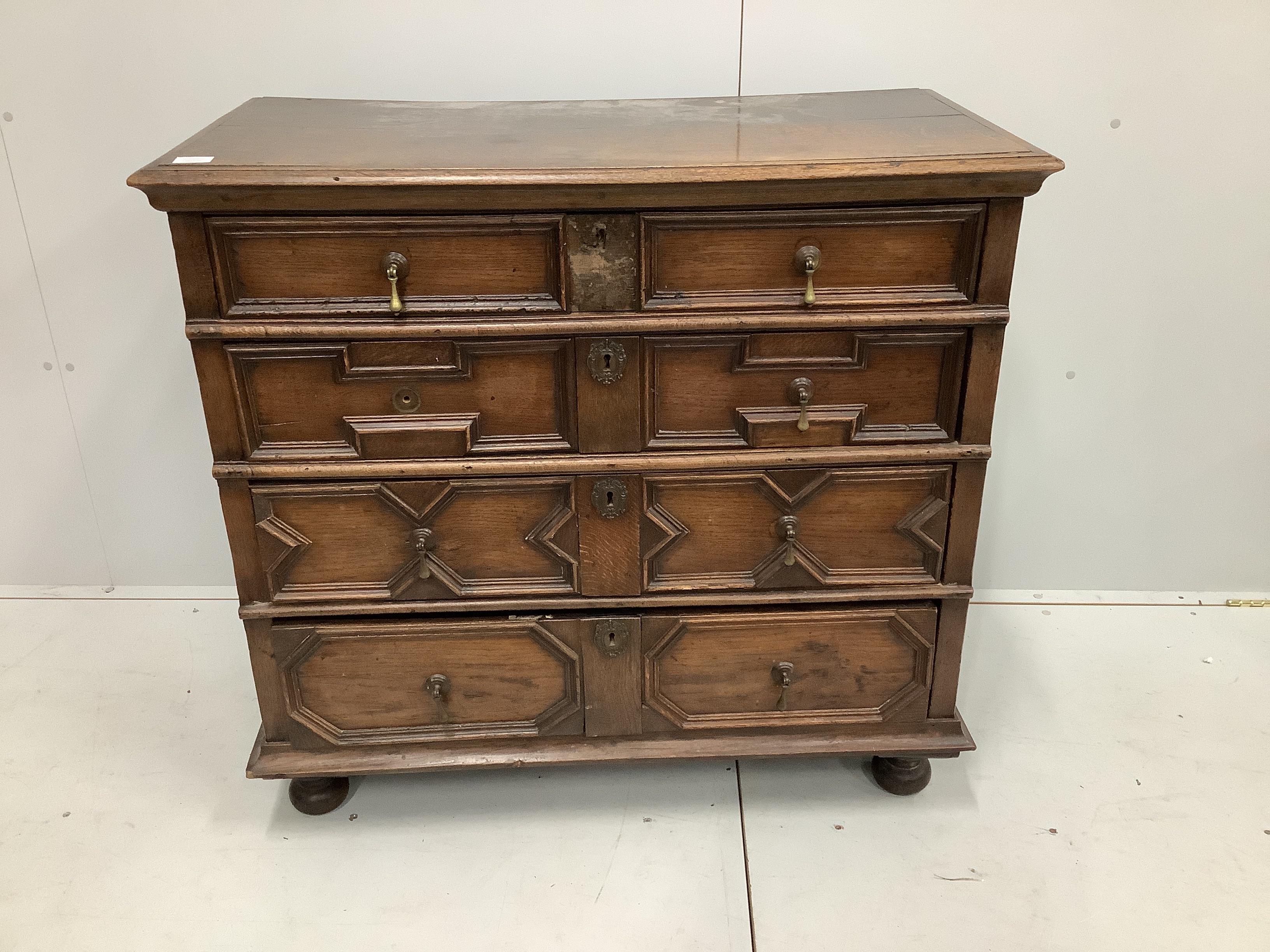 A 17th century Jacobean oak chest of four drawers, width 102cm, depth 51cm, height 97cm